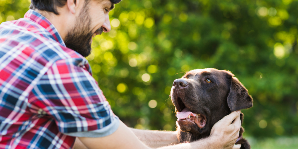 Man with black dog